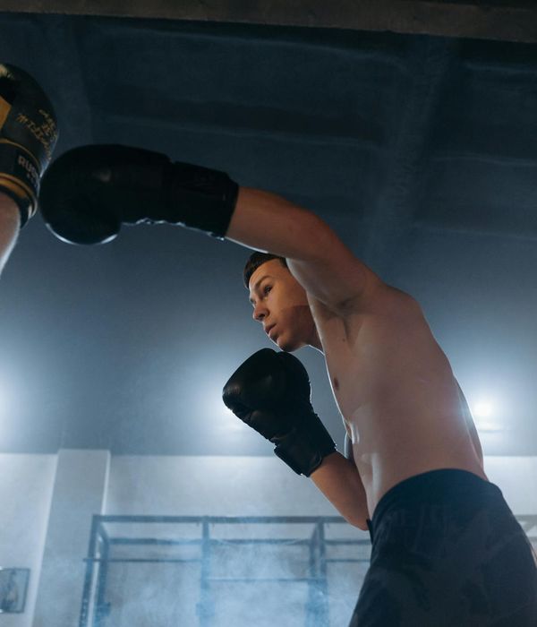 Man in a focused athletic stance, embodying strength and control.